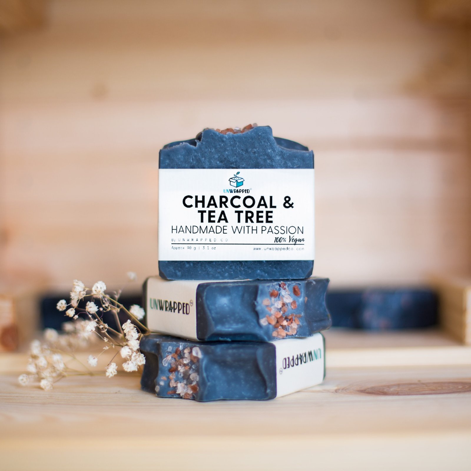 Unwrapped charcoal and tea tree soap bars