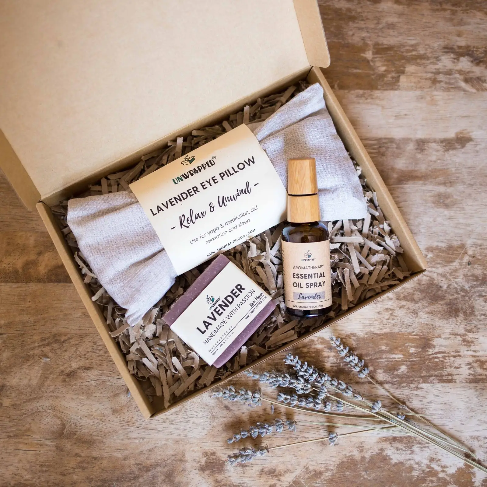 Unwrapped relaxation set with lavender eye pillow, lavender soap bar and lavender essential oil spray