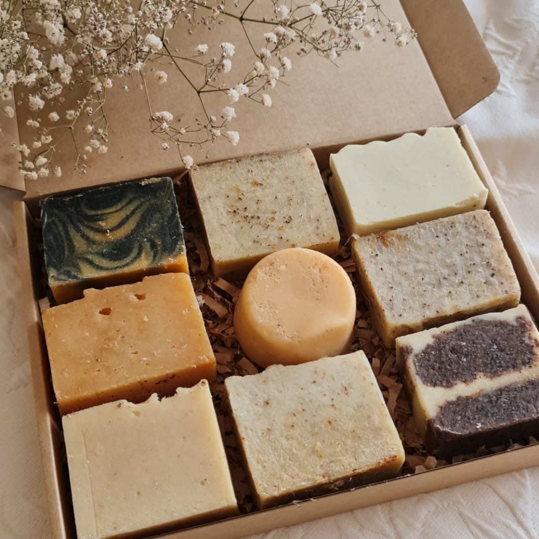 Unwrapped salvaged suds box of nine soap bars