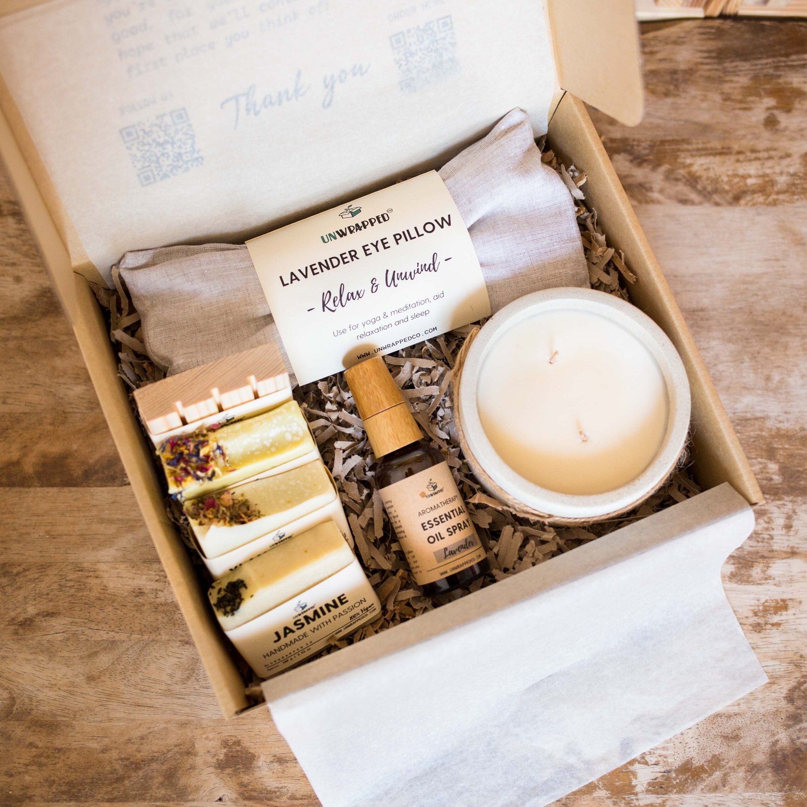 Unwrapped spoil her gift set with lavender eye pillow, large candle, essential oil spray, three soap bars and soap dish